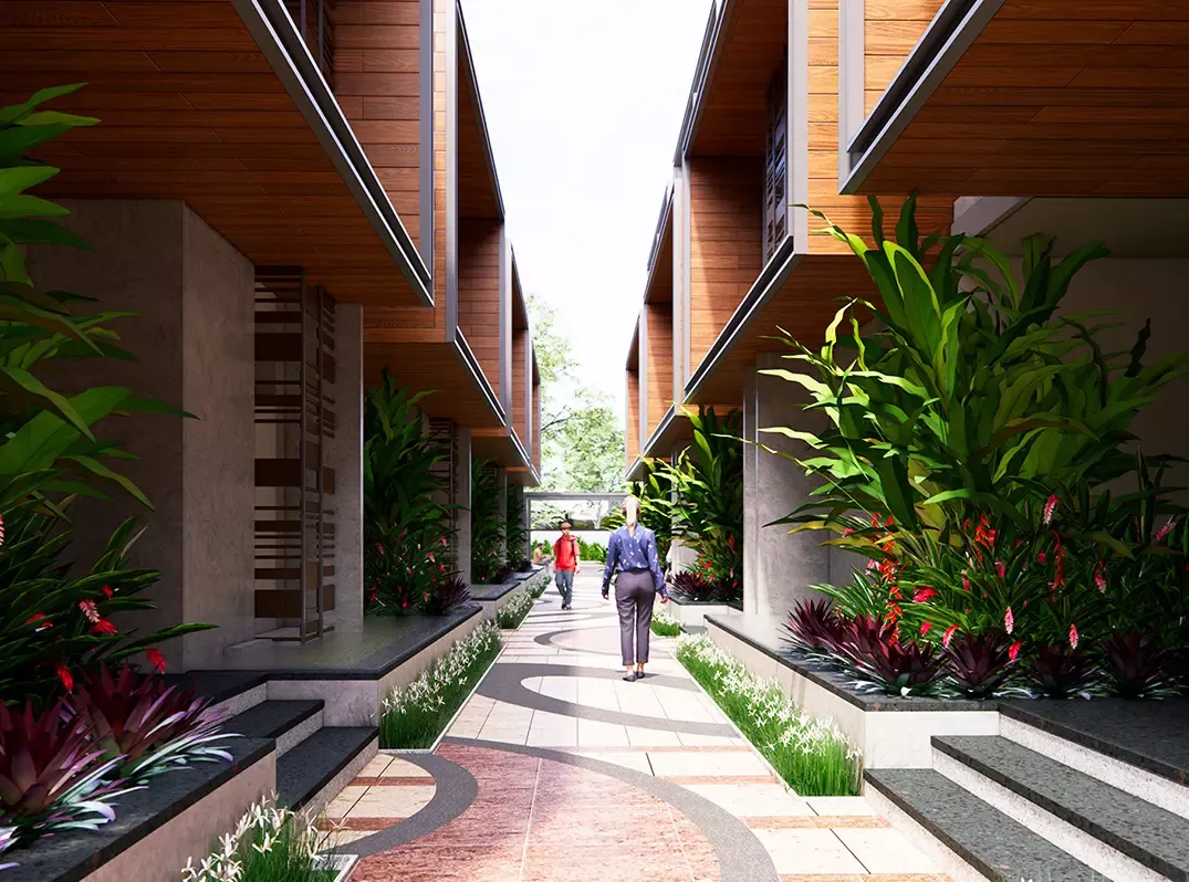 Landscaped walkway between the villa rows at Sattva La Vita